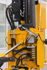 Part of bulldozer - mechanism of the bucket scraper