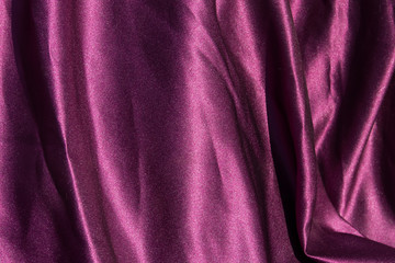Obraz premium Purple satin background. Silk texture. Fabric pattern