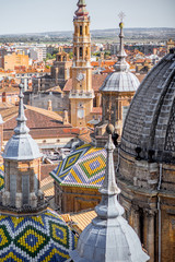 Aerial cityscape view on the roofs and spires with beautiful tiles of basilica of Our Lady in Zaragoza city in Spain
