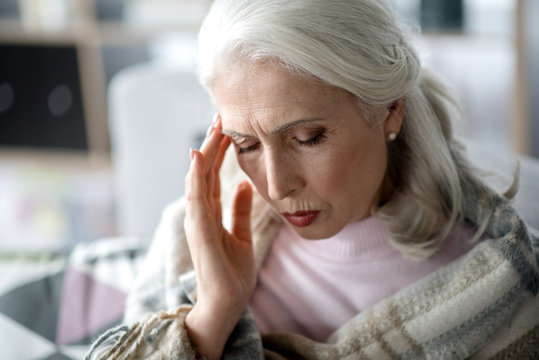 Mature woman suffering from headache