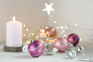 pink christmas decoration. balls and candles. selective focus