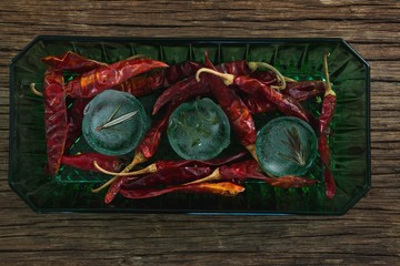 Flavored ice cubes with herb and dried red chili pepper