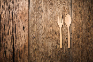 wooden spoon on old brown vintage wooden floor texture with free copyspace for your text