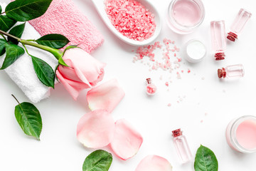 Natural organic cosmetics with rose oil. Cream, lotion, spa salt on white background top view