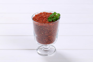 glass of red rice