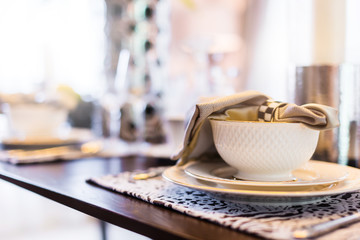 dining set with dish and spoon on white clean napkin