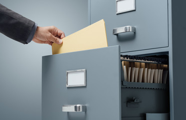 Office clerk searching files