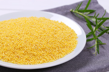 plate of raw millet grains