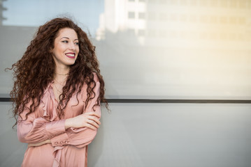 Portrait of a happy beautiful young redhead woman