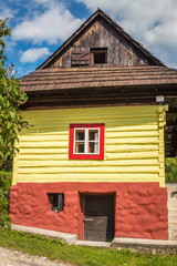Fototapeta na wymiar An ancient colorful house in the Vlkolinec village, Slovakia, Europe.