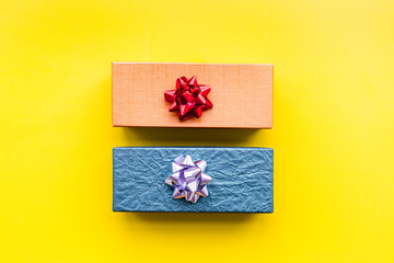 Wrapped gifts for boxing day 2018 pattern on yellow background top view copyspace