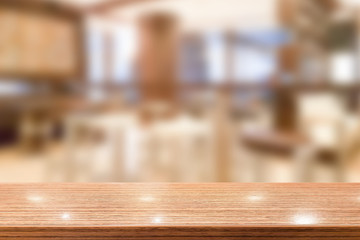 Wood table top with blur cafe interior to promote your products