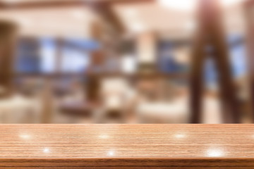 Wood table top with blur cafe interior to promote your products