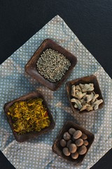 Various spices in a wooden tray