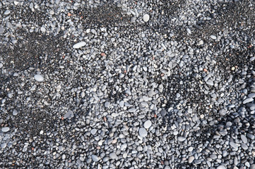 Vik  -  Reynisfjara Beach - basalt cliffs in a typical Icelandic landscape, a wild nature of rocks and shrubs, rivers and lakes.