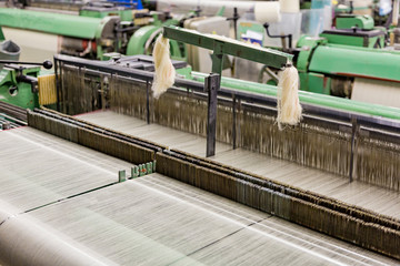 Part of the obsolete green loom at the weaving factory
