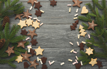 Christmas cookies and pine tree branches background, mockup