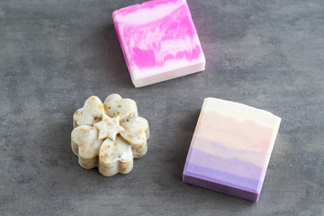 Handmade organic soap bars in bright pink colors. Top view. Beauty blogger concept.