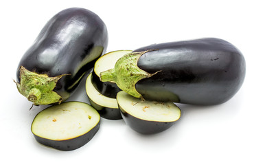 Two whole and sliced eggplants (aubergine), slices, isolated on white background