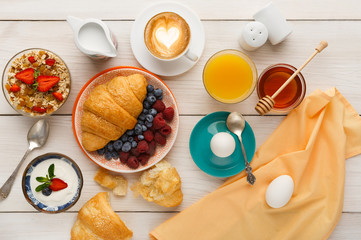 Continental breakfast menu on woden table