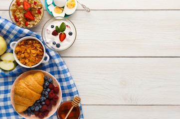 Rich breakfast menu on wooden table, copy space