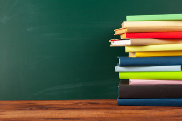 Books on Desk, Chalkboard Background