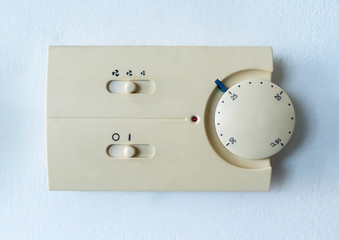 Old air condition controller switch on white background
