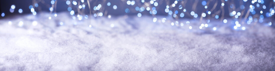 Christmas winter landscape with snow and magic  blurry bokeh lights  -  Banner