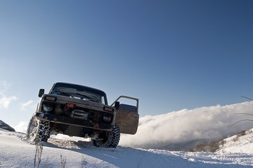 The SUV in the snowy mountains