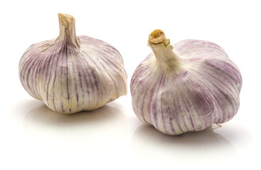Two whole garlic bulbs isolated on white background