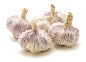 Group of five whole garlic bulbs isolated on white background