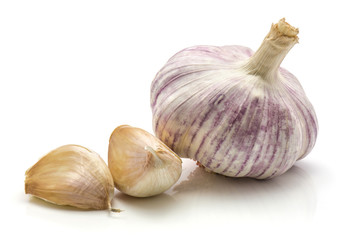 One whole garlic and two cloves isolated on white background
