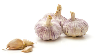 Garlic isolated on white background three whole bulbs and three separated cloves