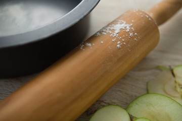 Close up of rolling pin by container