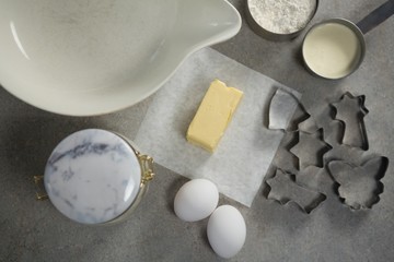 Overhead view of pastry cutters with ingredients and containers