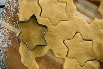 Overhead view of star shape cutter on dough