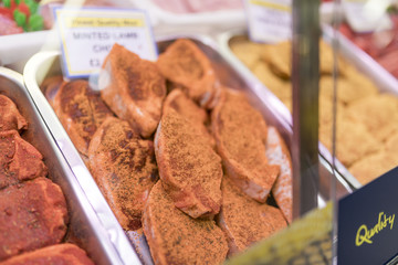 Tray of finest minted lamb chops on a butchers tray on a butchers market stall in Yorkshire, England in the UK