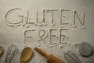 Gluten free text on flour with utensils