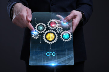Business, Technology, Internet and network concept. Young businessman working on a virtual screen of the future and sees the inscription: CFO
