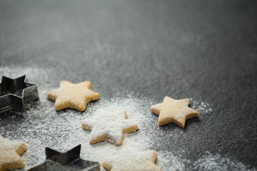 Close up of star shape cookies with pastry cutter