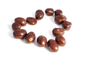 Peanuts in chocolate isolated on white background.