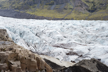Hiking in Skaftafell, typical Icelandic landscape, a wild nature of rocks and shrubs, rivers and lakes.
