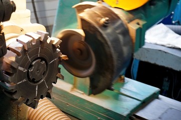 metalworking industry: finishing metal working on horizontal surface grinder machine with flying...