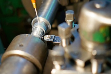 Technicians are turning lathe with horizontal lathe machine.