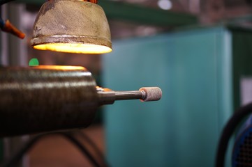 metalworking industry: finishing metal working on horizontal surface grinder machine with flying...