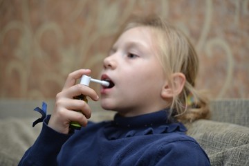 Small child taking medicine