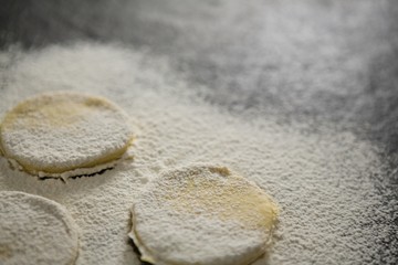 Fototapeta na wymiar Close up of flour on unbaked cookies