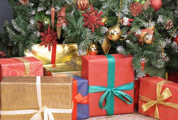 Fototapeta na wymiar Christmas presents under new year tree