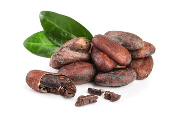 unpeeled cocoa bean with leaf isolated on white background