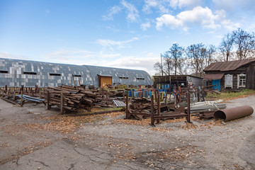 Dump of metal rusty waste on an abandoned plant territory
